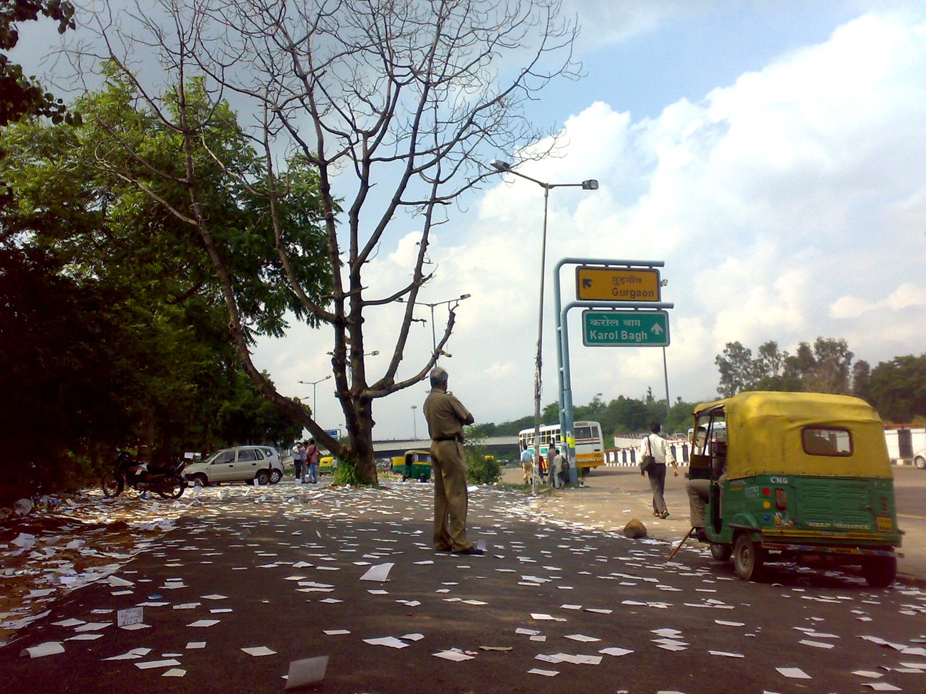A road littered with discarded campaign pamphlets after a student union election