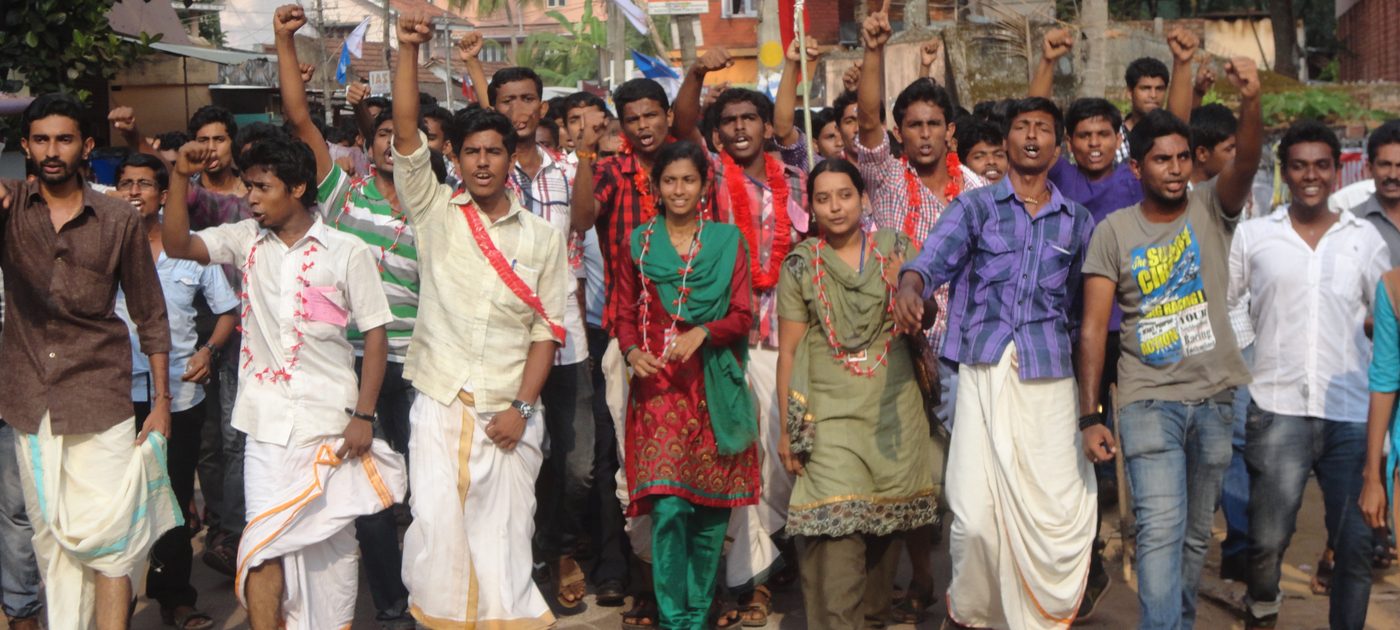 Garlanded students walking together after a students' union election result