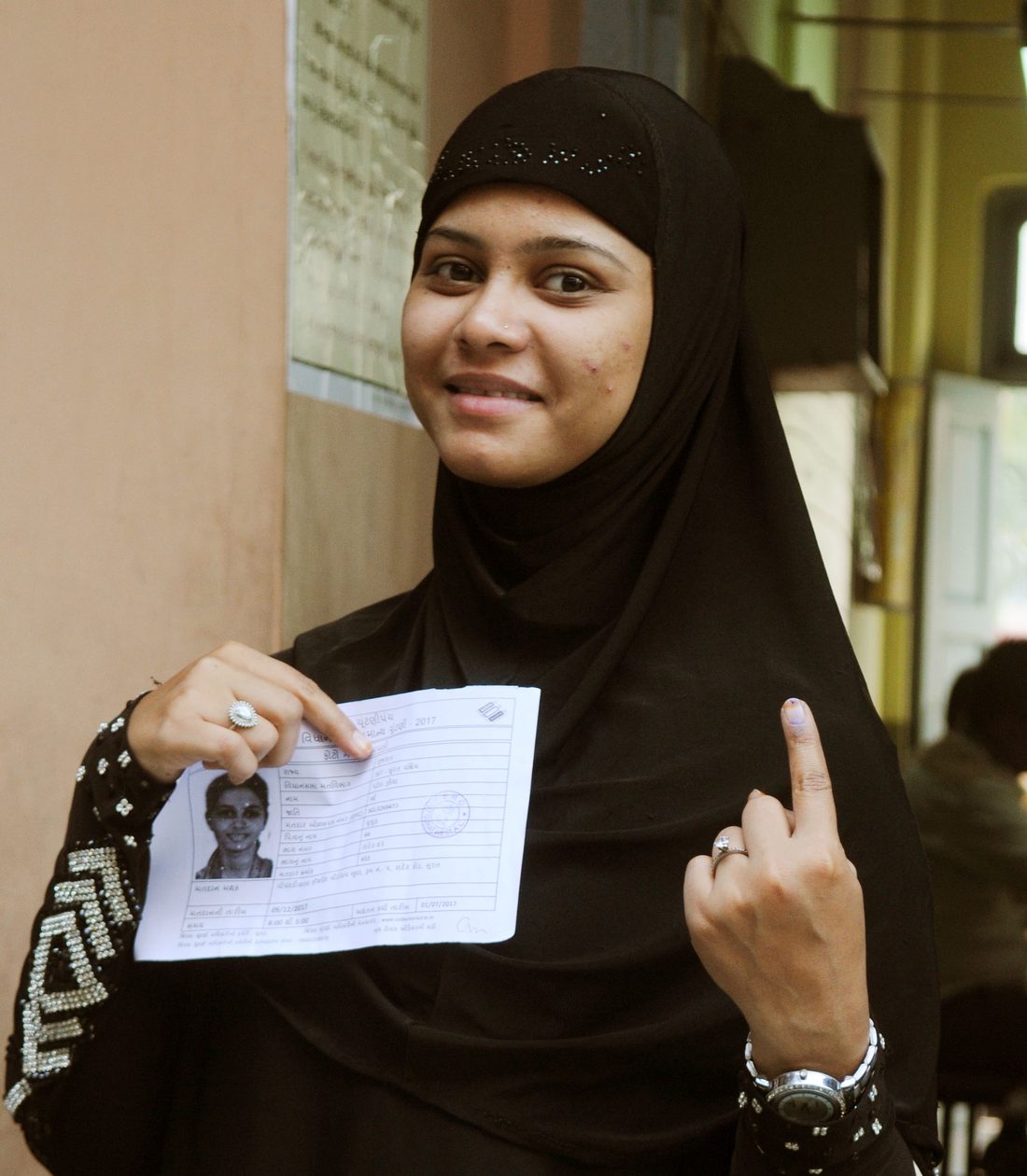 A voter showing an inked finger after voting
